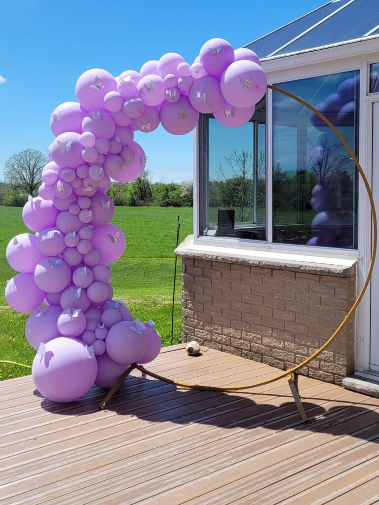 Violet Butterfly Theme balloon garland on gold ring prop