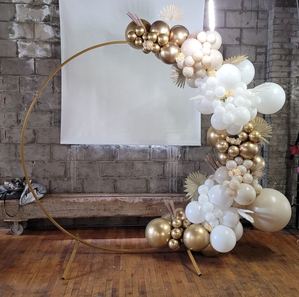 balloon garland white gold nude balloons pampas grass palm leaves 