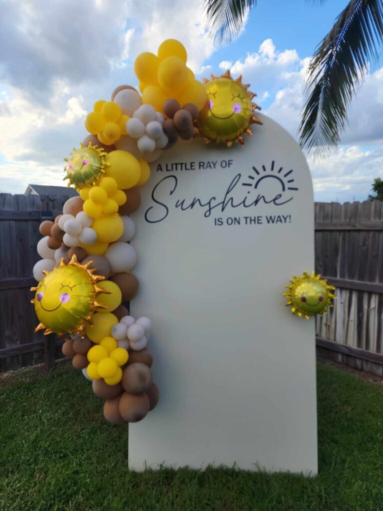 a little ray of sunshine golden yellow, chocolate brown white balloons mylar sunshine white 7ft backdrop